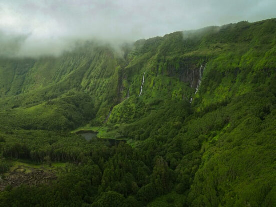 A wall of waterfalls surrounded by a veil of mist on the island of Flores in the Azores